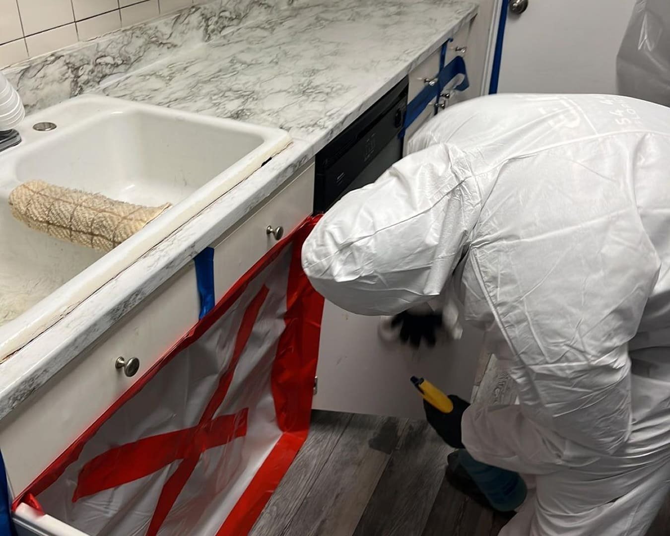 DryProTek certified mold remediation specialist conducting containment